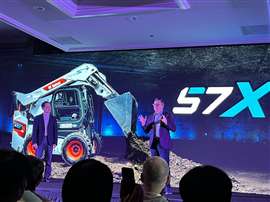 Doosan Bobcat presenting the all-electric 57X skid steer loader at CES 2024.