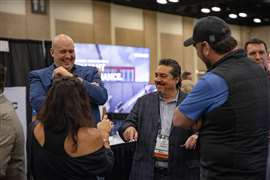 A group of contractors in conversation, laughing