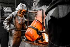 Foundry worker pours metal (Image: Adobe Stock)