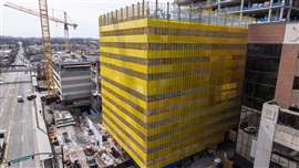 The Doka protection screens erected on the 12-story administrative building known as Oxford House. 