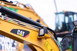 Caterpillar logo on a digger arm at a CAT machine dealer.