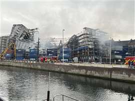 The Old Stock Exchange building still smoldering