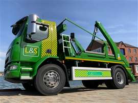 An L&S Waste Management skip truck