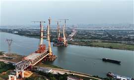 Construction workers are working in China's Nanchang-Jiujiang High-speed Railway Ganjiang River Highway and Railway Bridge, the China's first 350km/h mixed-layer bridge, in Nanchang, Jiangsu province, China, Oct 10, 2024. (Photo by CFOTO/Sipa USA)