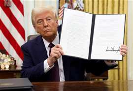 Donald Trump signs an executive order (Image: REUTERS/Kevin Lamarque)