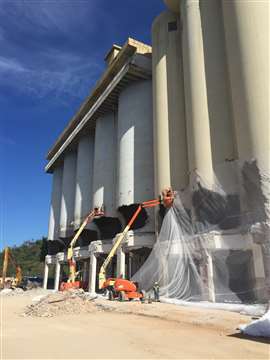 Fabio Bruno operatives in mobile elevating work platform work on the demolition of the silos at the AB InBen facility in Rio de Janeiro