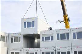 Setup of the 'container castle', home of the exhibition directory, in the outdoor area bauma 